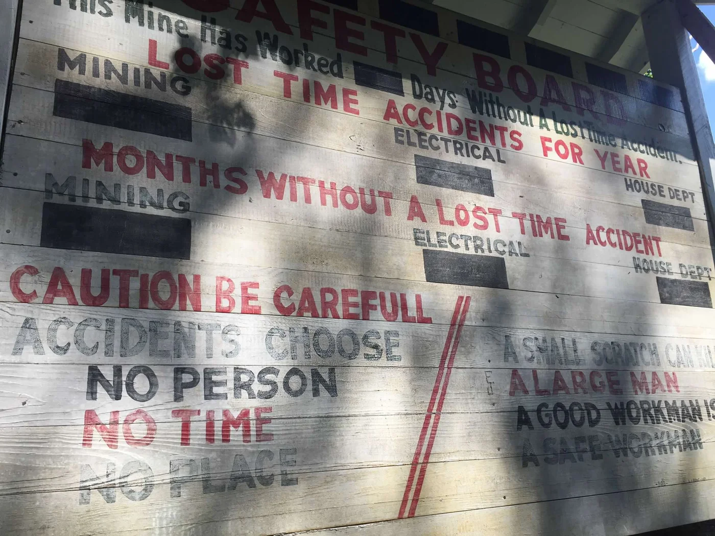 The Kaymoor mine Safety Board — still standing in the overgrowth, exactly where it was posted when the mine ran