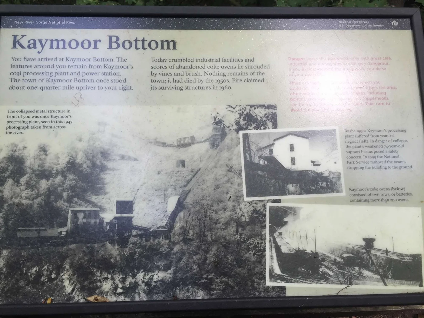The NPS interpretive sign at Kaymoor Bottom — "scores of abandoned coke ovens lie shrouded by vines and brush"