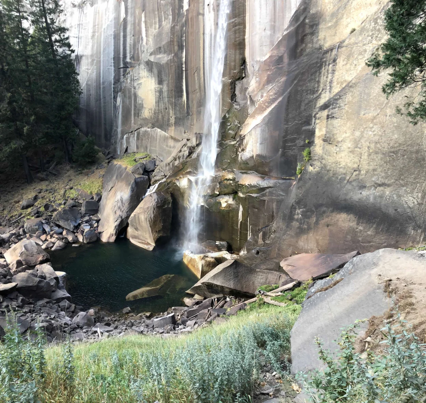Looking straight down at the top of Vernal Fall — 317 feet of granite staircase below you, the gorge below that.