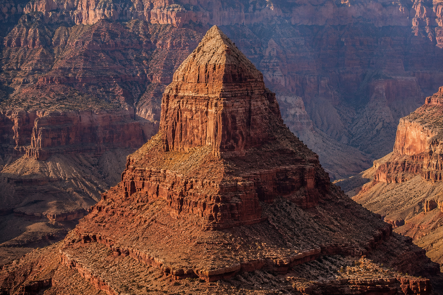 Dramatic Grand Canyon canyon walls with massive temple-like buttes rising from the gorge