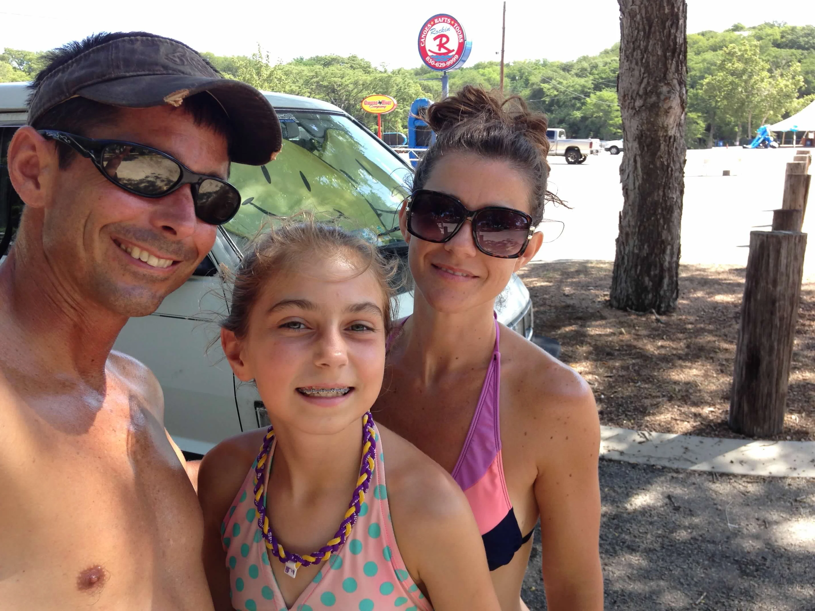 Family at a Texas river tubing and canoe rental shop before heading out on the water