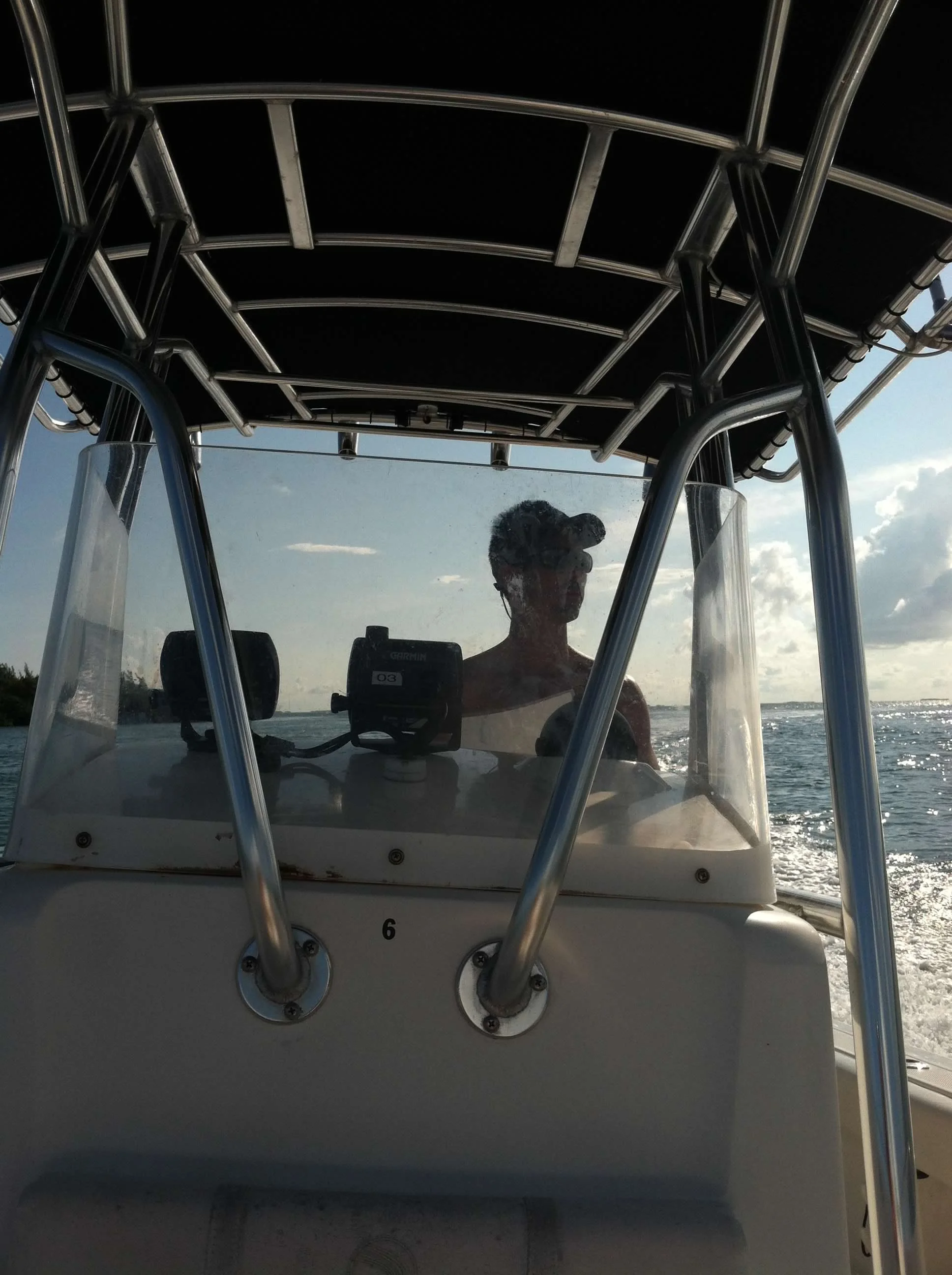 Checking GPS and gear aboard a rented boat off Key West before heading out to the reef