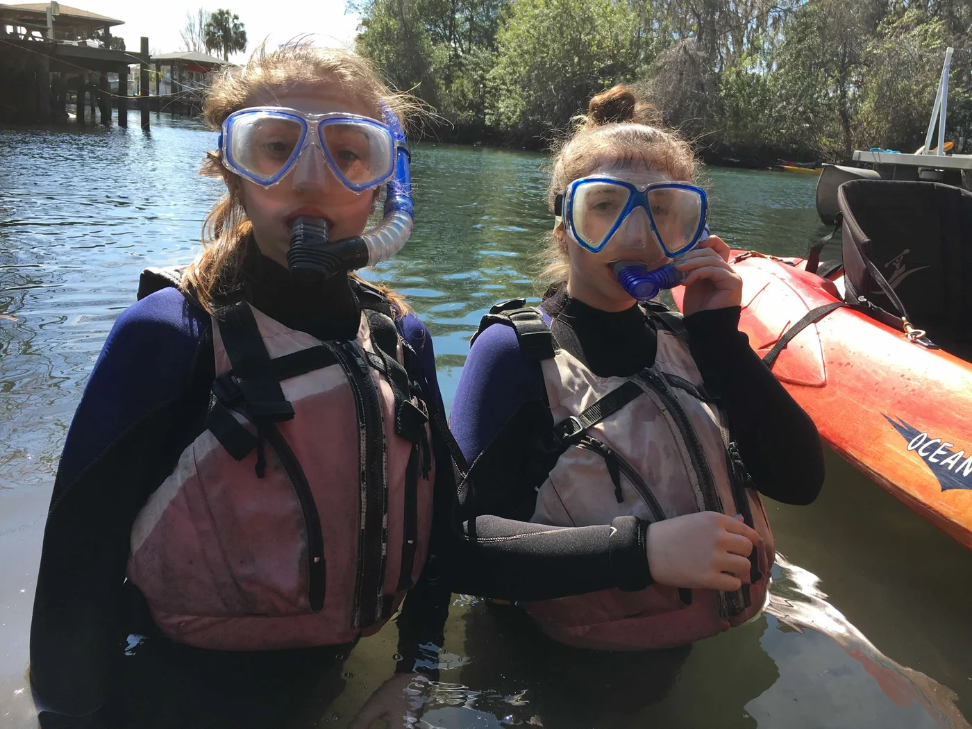 Two of the kids geared up for the Crystal River manatee swim — wetsuits in February, no complaints registered