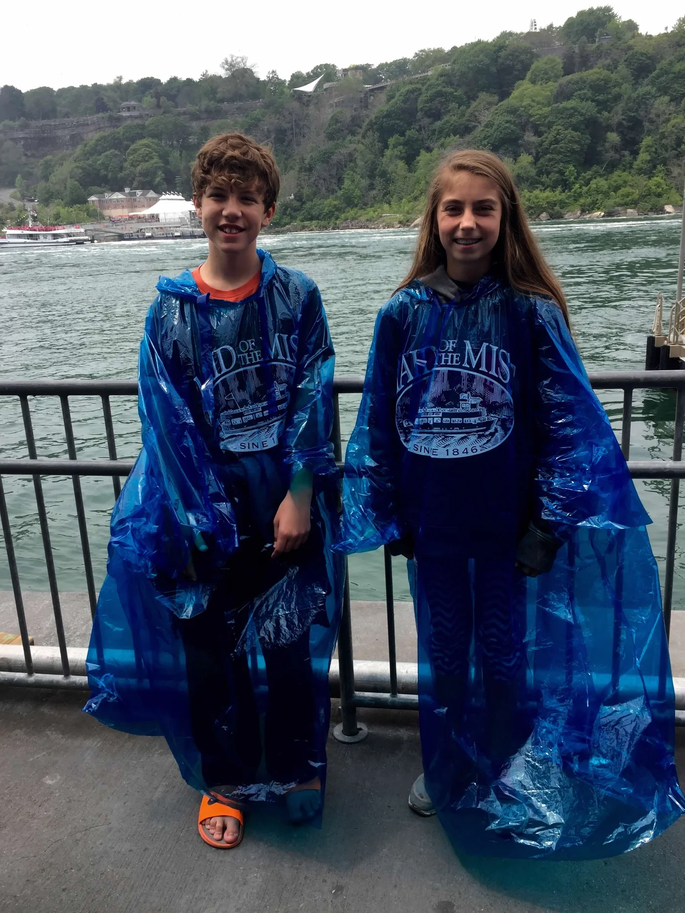 Zac on the Maid of the Mist — blue poncho, Horseshoe Falls, completely soaked