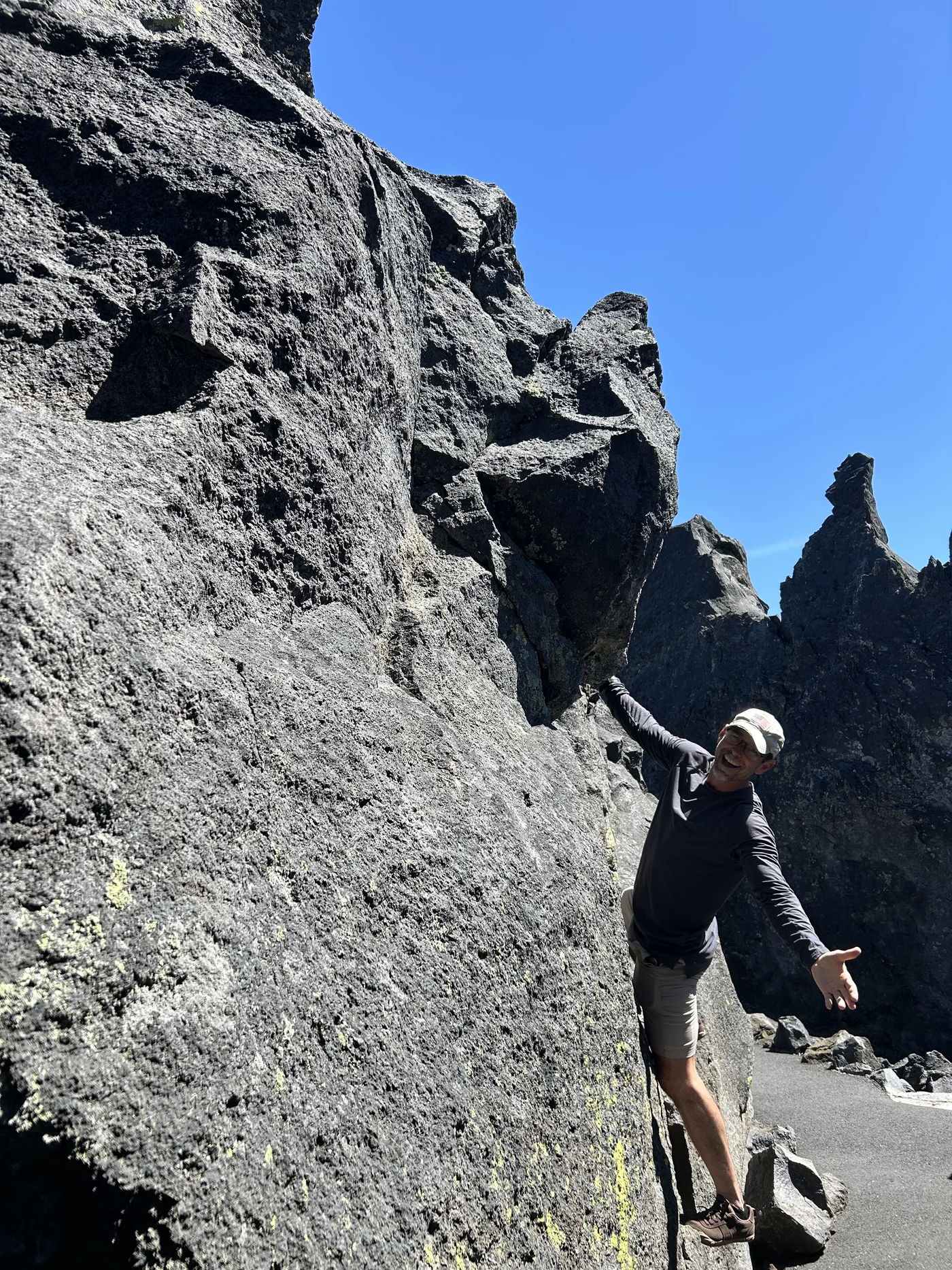 The McKenzie Pass lava fields — the Pacific Crest Trail crosses 9 miles of basalt from a flow 1,500 years old. The Dee Wright Observatory, built by the CCC in 1935, sits at the summit.