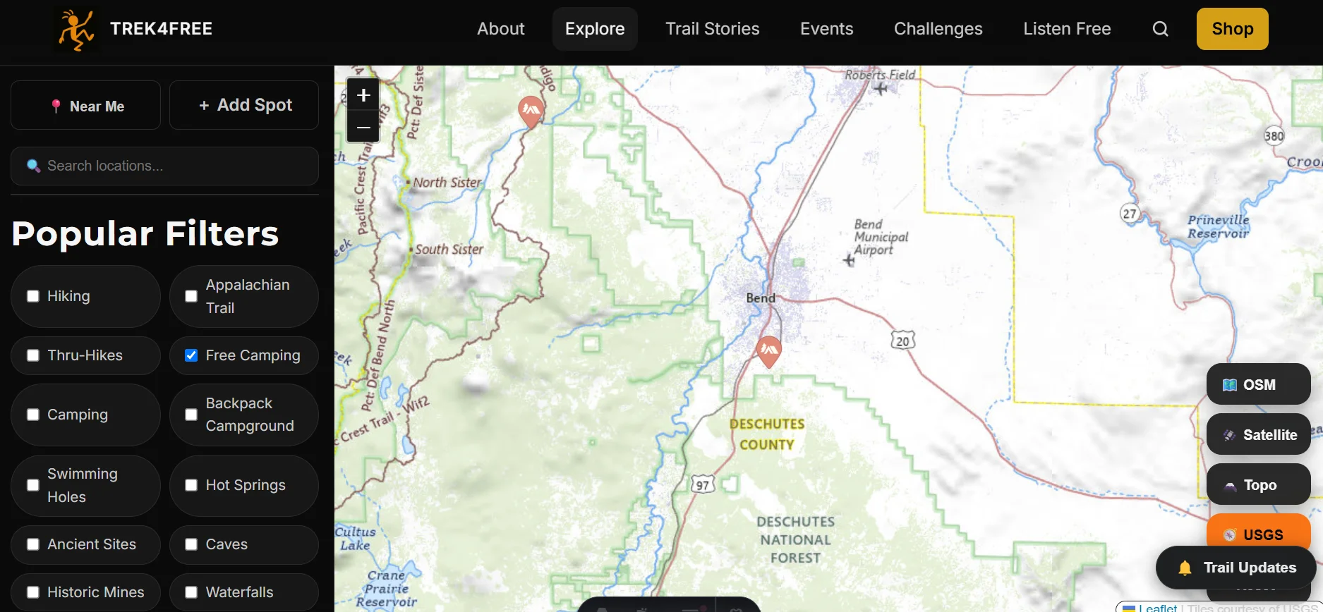 Trek4Free map layer selector — OSM, Satellite, Topo, and USGS options in the bottom right corner of the Explore map. Switch to USGS to see land ownership boundaries and terrain contours.