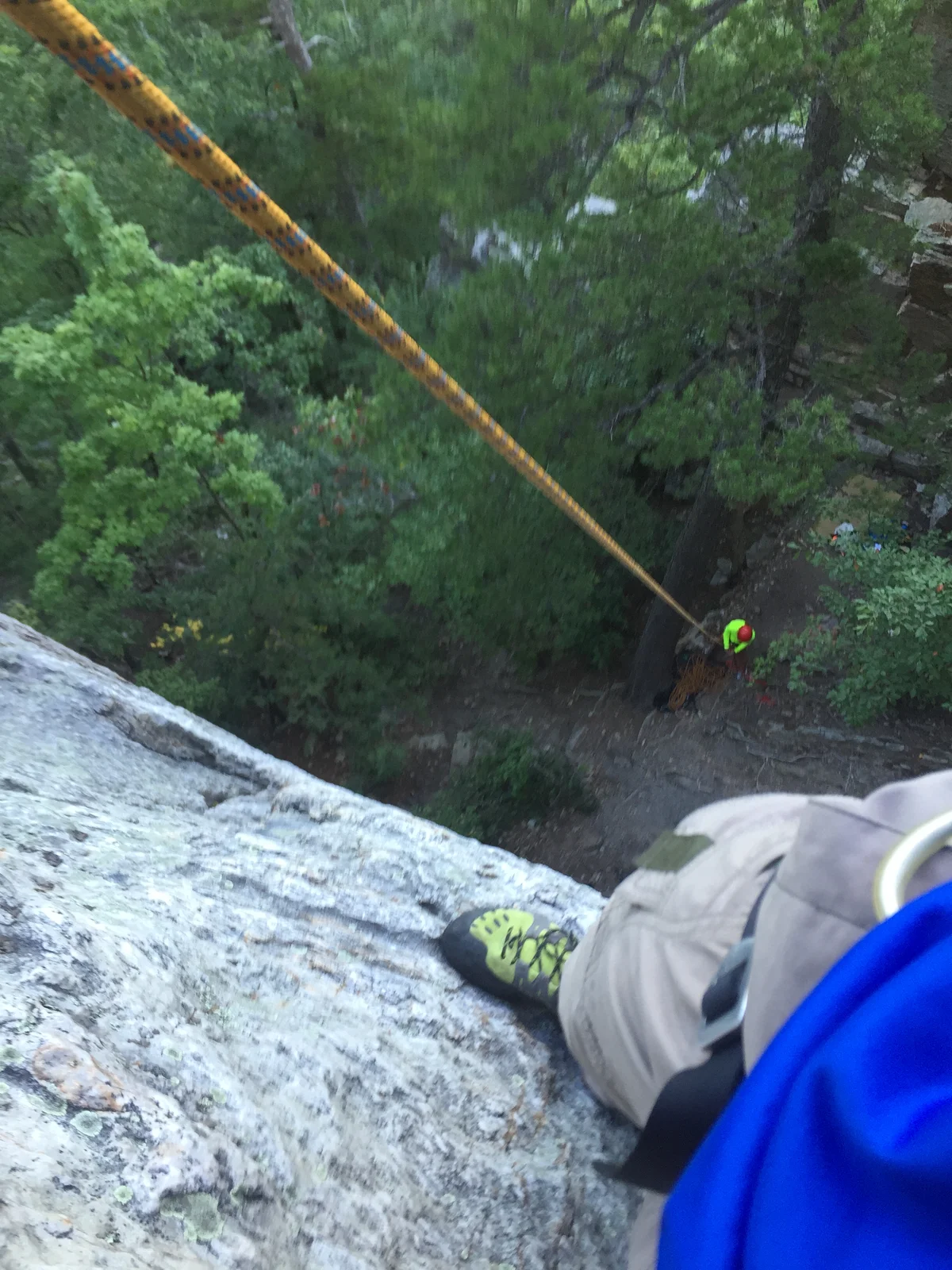 The view looking down a rock face while climbing in West Virginia